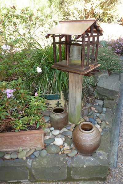 Japanese bell at courtyard - and house - entry
